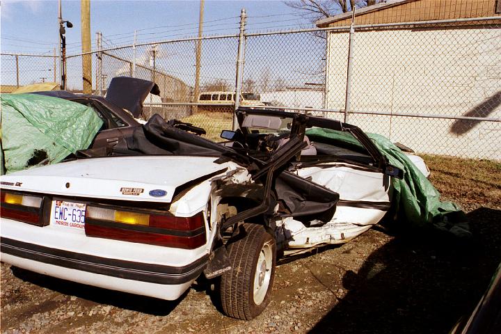 010_8A.JPG - Most of the body damage was caused when I crossed over the center and was struck by a new Ford Explorer.